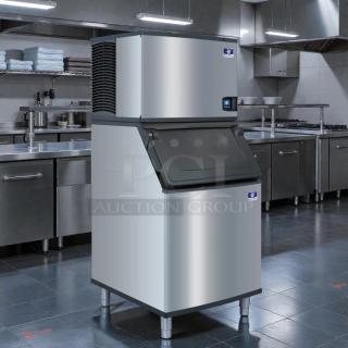 Manitowoc SY0854A air-cooled ice maker in excellent condition, tested and working, in a commercial kitchen setting.