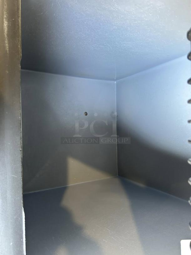 Manitowoc SY0854A air-cooled ice maker interior, excellent condition, clean surfaces, indicating tested and working functionality.