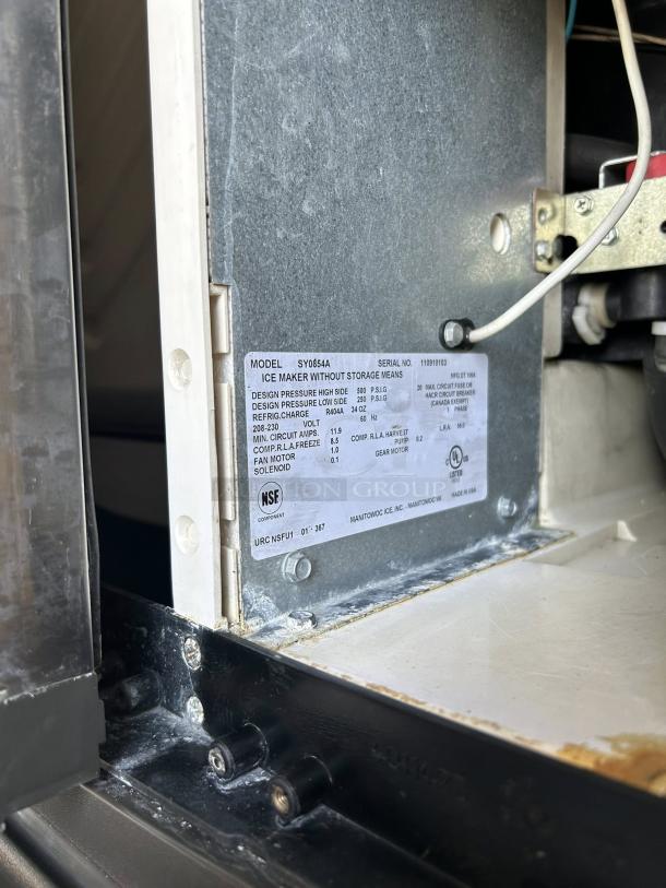 Manitowoc SY0854A ice maker, air-cooled, excellent condition, tested and working, model label visible, NSF certified.