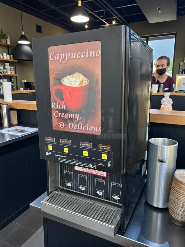Curtis PC-4D-10-01 cappuccino dispenser, 4 station, excellent condition, tested and working, labeled "Rich, Creamy, Delicious."