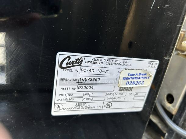 Curtis PC-4D-10-01 cappuccino dispenser label showing model, serial, and asset numbers, voltage, and UL certification.