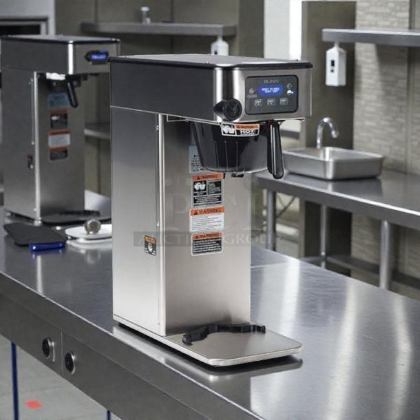 Bunn 53100.0000 ICB-DV coffee brewer in excellent condition, dual voltage, tested and working. Stainless steel, control panel visible.
