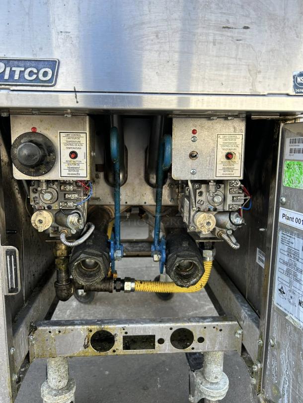 Pitco SG14TS natural gas split pot fryer, 20-25 lb. capacity, 100,000 BTU, excellent condition, visible controls and piping.