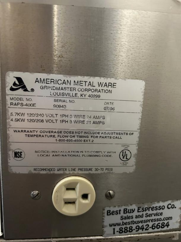 Grindmaster RAPS-400E coffee brewer label detailing model, serial number 90943, voltage, and warranty information.