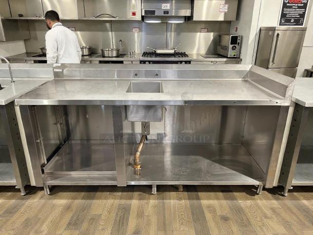 Winholt stainless steel worktop table with hand sink, backsplash, in excellent condition. Perfect for commercial kitchens.