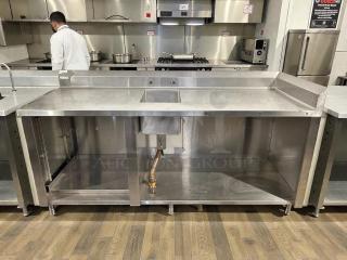Winholt stainless steel worktop table with hand sink, backsplash, in excellent condition. Perfect for commercial kitchens.