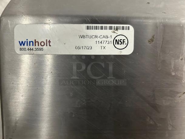 Winholt stainless steel worktop table with hand sink, backsplash, and NSF label. Model WBTUCR-CAB-1. Excellent condition.