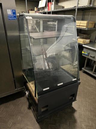 STRUCTURAL CONCEPTS S82755 27” curved bakery dry display case, tested, working condition, clear glass, black base.