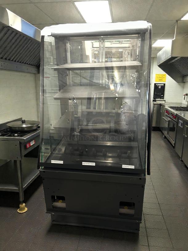 STRUCTURAL CONCEPTS S82755 27” bakery dry display case, curved glass, tested, working condition, in commercial kitchen.