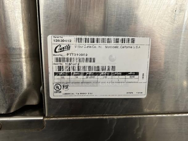 TRINITY stainless steel worktop table, model TLS-1901, 24-inch, excellent condition with minimal wear, visible labels.