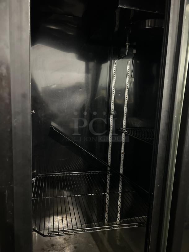 Bush FS52SDHC 52" floral cooler, excellent condition, tested and working. Features two swinging glass doors.