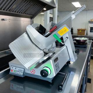 Bizerba GSPHDI90 meat slicer, aluminum, 13" blade, safety dial, 1/2 hp motor. Tested, great condition, illuminated controls.