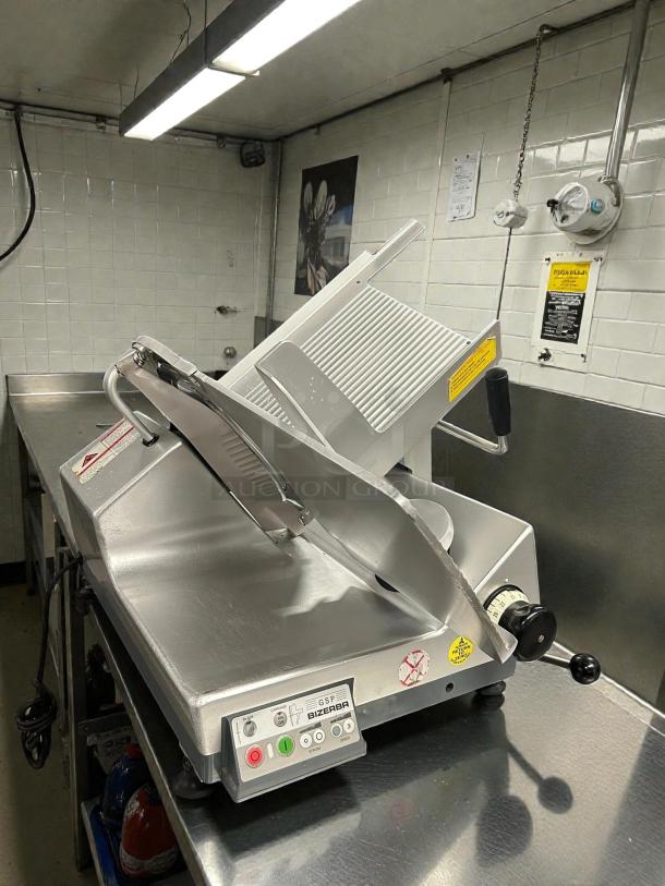 Bizerba GSPHDI90 automatic meat slicer, 13" blade, aluminum, safety dial, 1/2 hp, excellent condition, tested working.