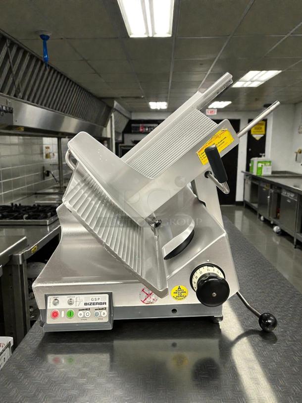 Bizerba GSPHDI90 meat slicer, great condition, aluminum, 13" blade, safety illuminated dial, automatic, 1/2 hp, tested working.