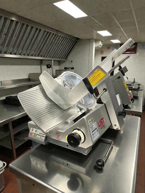 Bizerba GSPHDI90 automatic meat slicer, 13" blade, aluminum, safety illuminated dial, in excellent condition.