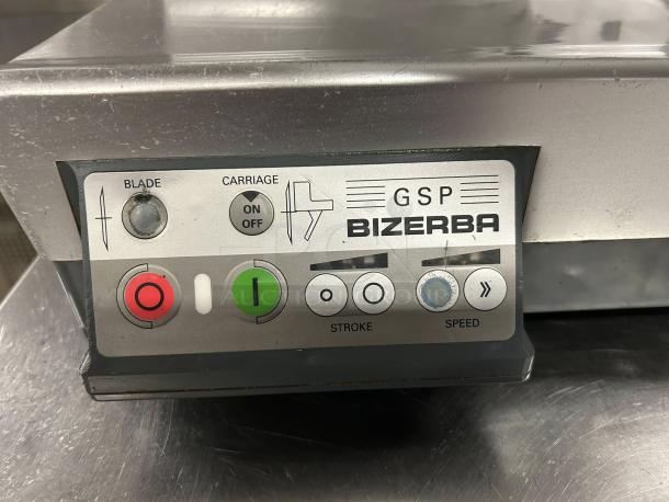 Bizerba GSPHDI90 meat slicer control panel with safety illuminated dial, blade and carriage controls, in great condition.