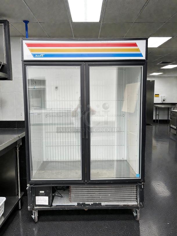 True GDM-49F-HC~TSL01 54" glass door merchandiser freezer, 2 sections, excellent condition, tested and working, visible tag.