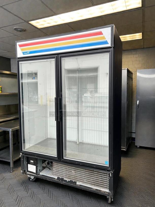 True GDM-49F-HC~TSL01 54" glass door merchandiser freezer, two sections, great condition, tested and working.