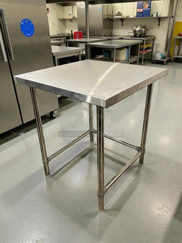 GSW 30” stainless steel worktop table, model WT-P3030, in great condition with an open base; durable for kitchen use.