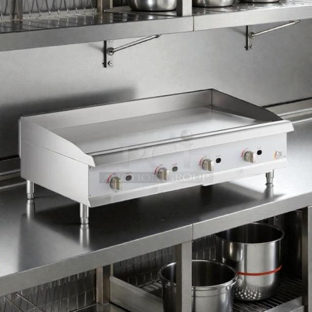 Cooking Performance Group GM-CPG-48-NL 48" gas griddle, 120,000 BTU, manual controls, excellent condition, tested and working.