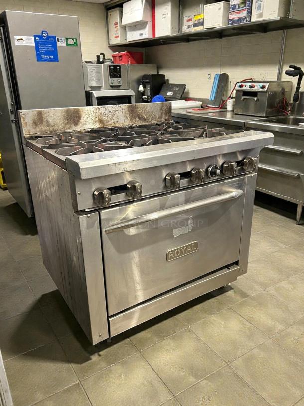 Royal RR-6-C 6-burner natural gas range with convection oven. Stainless steel, tested, working. Visible Royal logo on oven door.