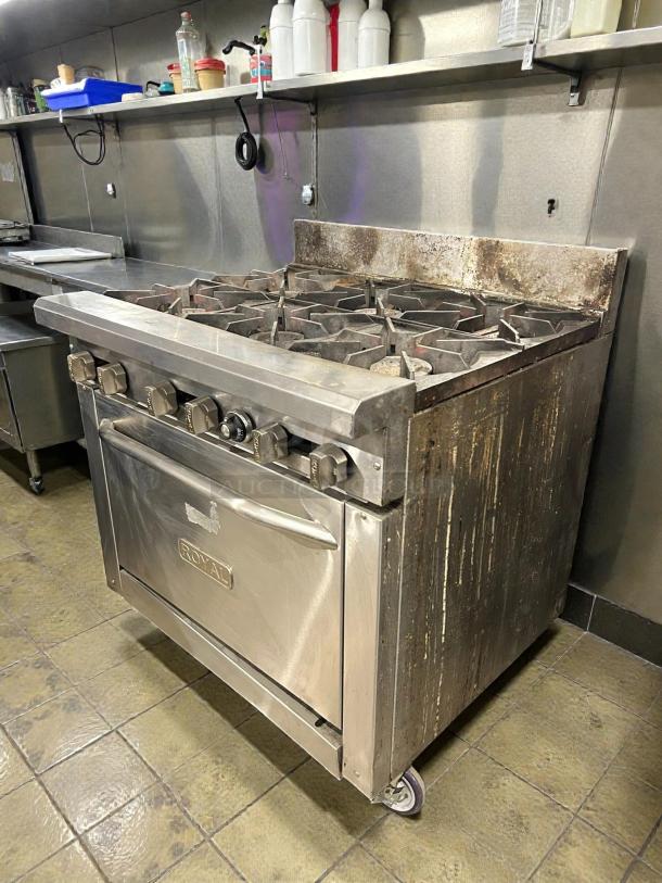 Royal RR-6-C 36" 6-burner natural gas range with convection oven. Tested, working, visible wear, Royal logo on door.