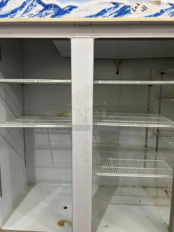 Blue Air BAGR72-HC 82" refrigerator merchandiser with 3 glass swing doors. Good condition, features R290 refrigerant, 72 Cu. Ft capacity. Tags indicate Lot 41.