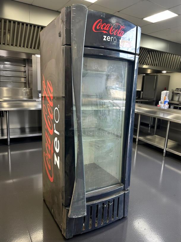 True GDM-26-HC~TSL01 refrigerated glass door merchandiser in great condition with Coca-Cola Zero branding, tested and working.