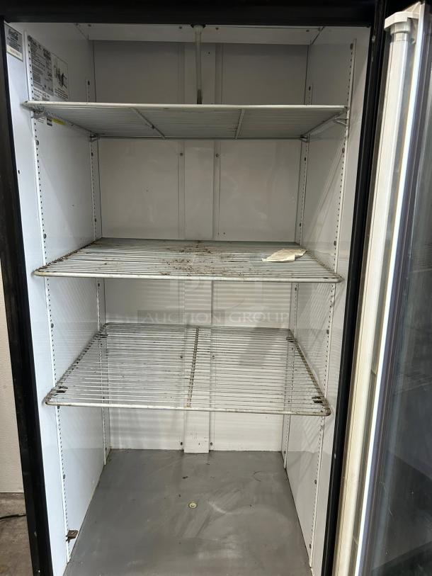 True GDM-26-HC~TSL01 refrigerated glass door merchandiser with three wire shelves, tested, in great working condition.