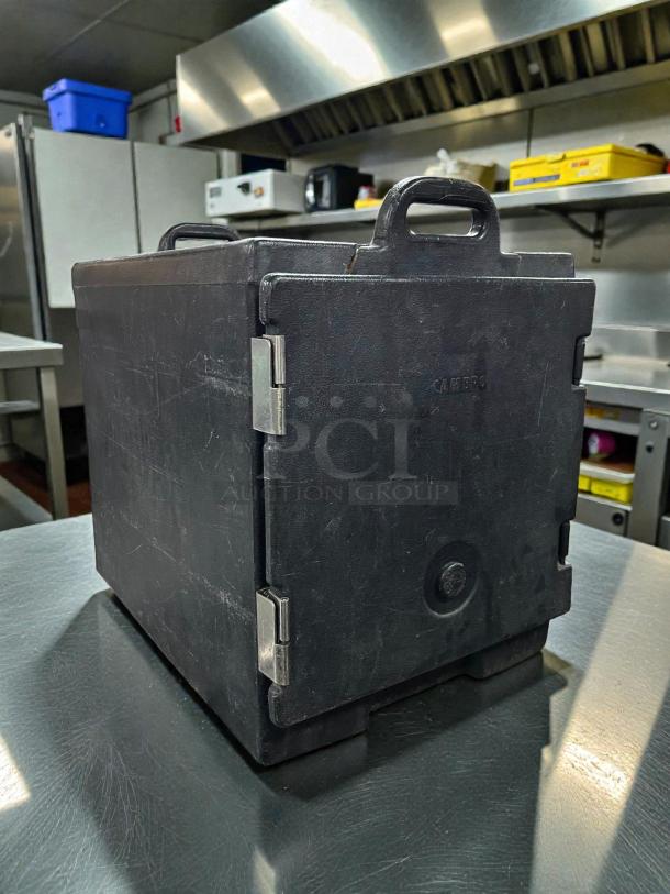 Cambro UPC400110 insulated black food pan carrier in great condition, holds 5 pans, durable with visible handles and hinges.