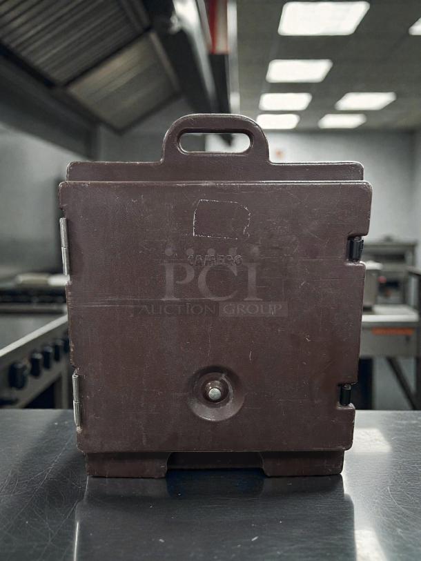 Cambro UPC400110 Camcarrier® in brown, holds 4 full-size 4" pans, excellent condition, visible logo.