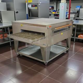 XLT 3255 Series Compact Conveyor Oven, 32" wide, 55" long chamber, tested and working, stainless steel, on casters.