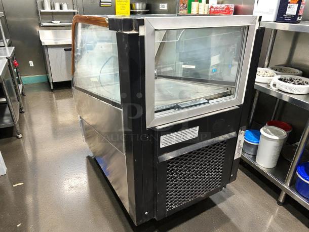 Structural Concepts DD17R countertop display case, excellent condition, tested and working, with glass panels and metal finish.