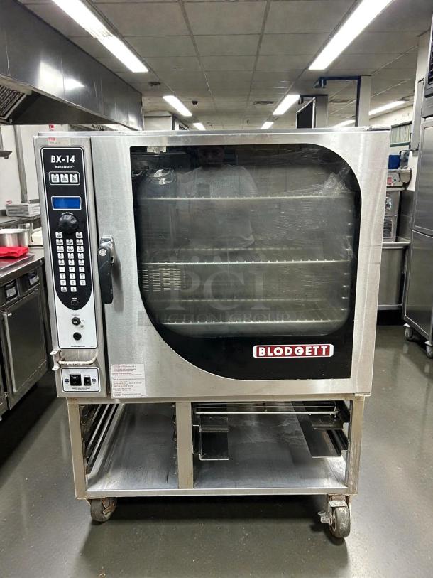 Blodgett BX-14G-NAT gas combi oven, 130,000 BTU, manual controls, tested and working, visible labels. Scuffs on base.