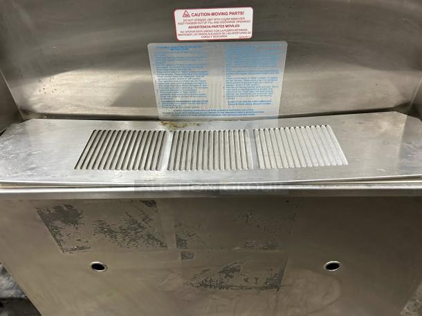 Taylor 772 Soft Serve Freezer, floor model, self-contained, dual flavor. Tested, working condition. Warning and operation labels visible.