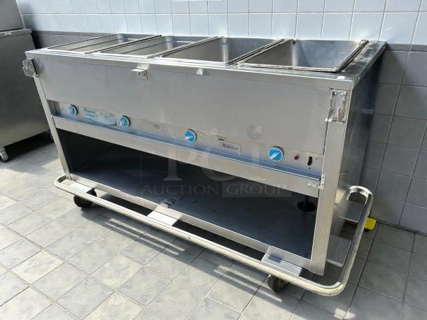 Duke Manufacturing E304SW 4-compartment hot food table, stainless steel, sealed wells, tested and working, excellent condition.