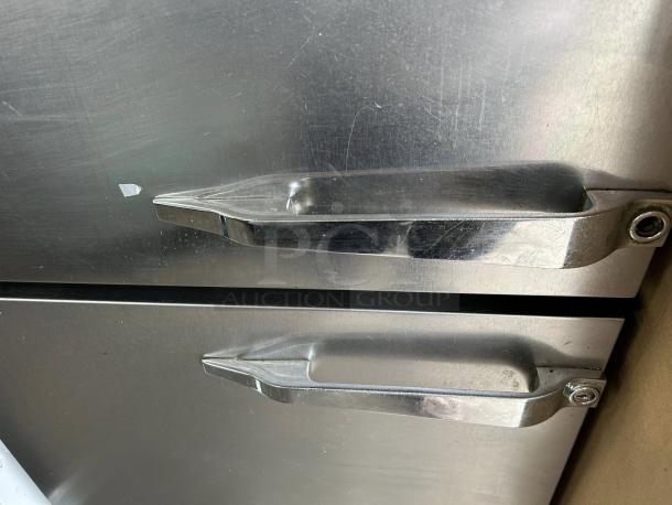 McCall 1-102001 28in Single Split Door Refrigerator, excellent condition, stainless steel, tested and working.