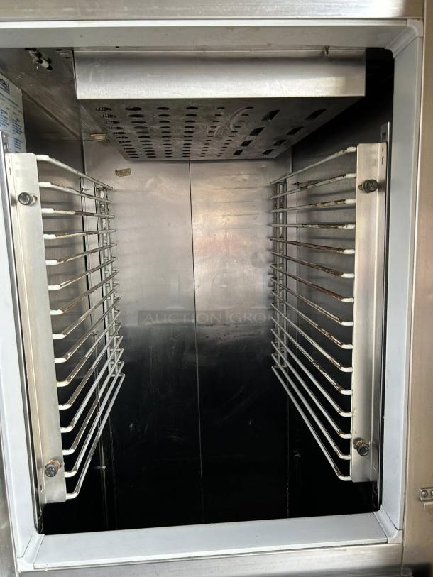 McCall 1-102001 28in Single Split Door Reach-In Refrigerator, excellent condition, interior racks visible, tested and working.