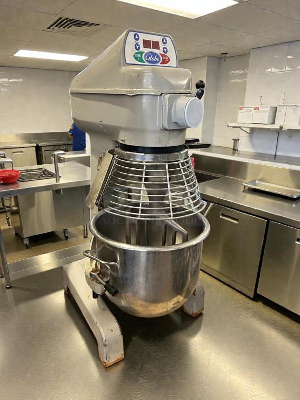 Globe SP20 20 Qt. planetary stand mixer with guard, tested and working. Features 1/2 hp motor, 120V power, standard accessories.