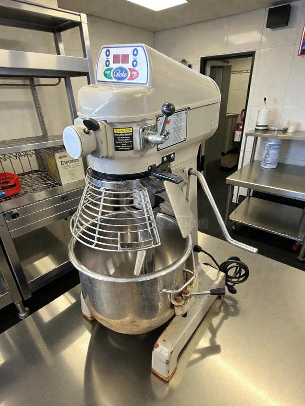 Globe SP20 20 Qt. Planetary Stand Mixer with guard, standard accessories, and digital controls; tested and working condition.
