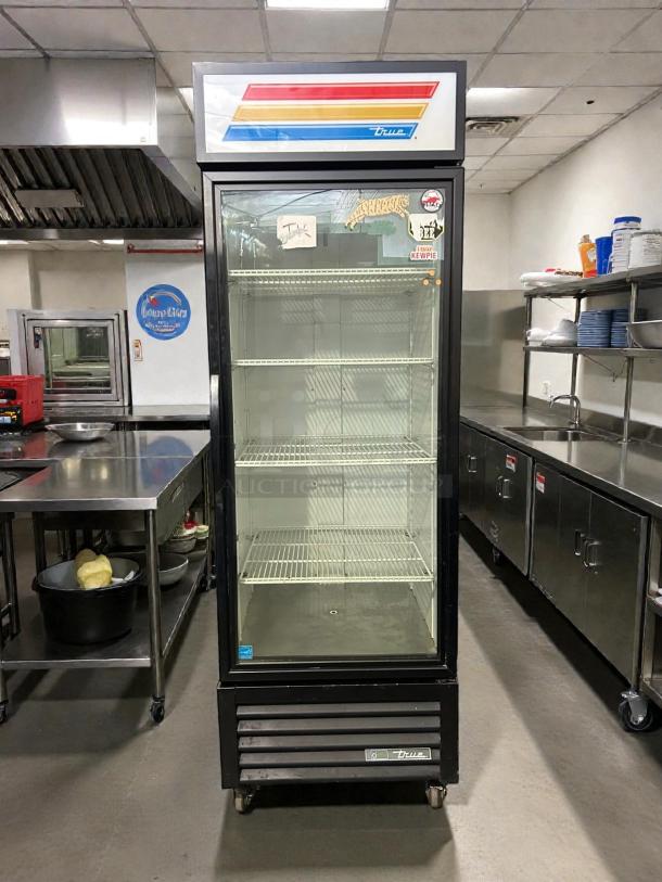 True GDM-23-HC~TSL01 27" glass door merchandiser, excellent condition, tested working, visible True logo, shelves intact.
