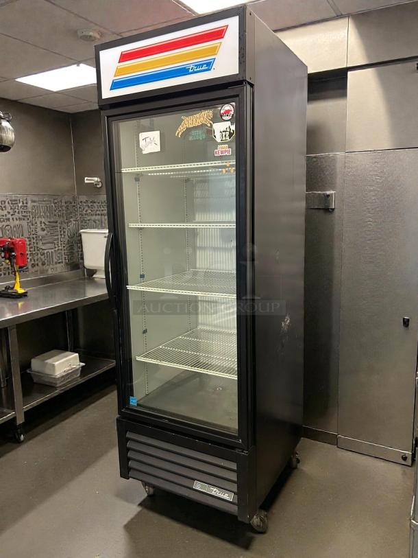 True GDM-23-HC~TSL01 refrigerated glass door merchandiser in excellent condition, 27", tested, clean interior shelves.