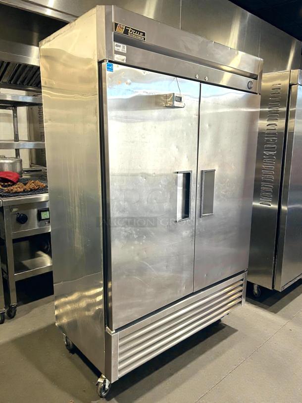 True T-49F-HC 54" reach-in freezer, 2 sections, stainless steel, on casters, great condition, tested and working.