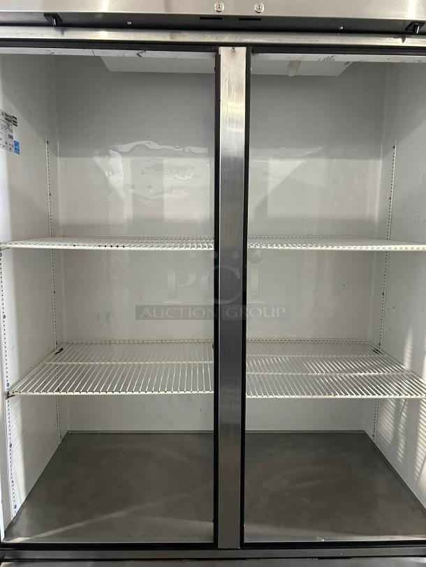 True T-49F-HC 54" reach-in freezer, 2 sections, tested and working, great condition. Visible shelves, clean interior.