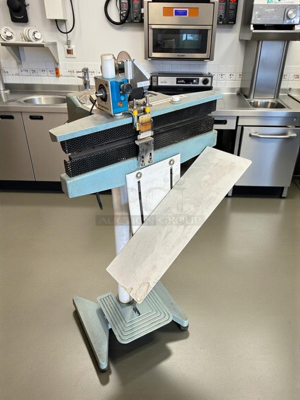 Uline H-28 24" foot-operated impulse sealer in great condition, tested and working, with visible control components.