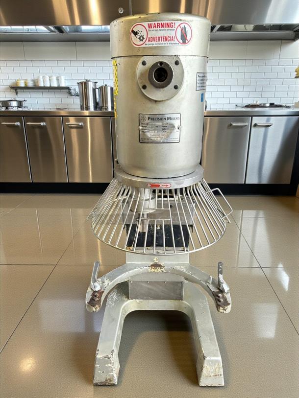 Precision Maker 60 Qt dough mixer, 220v, 3-phase, tested, working. Features warning labels and a sturdy metal frame.