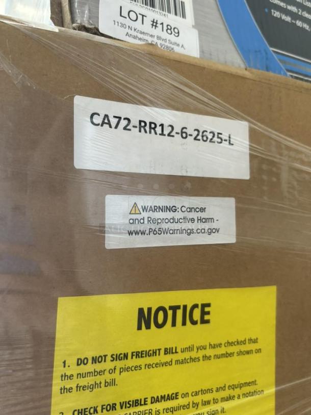 Brand new Lockwood CA72-RR18-CDD Dutch Door Display Cabinet in packaging, featuring warning labels and freight notice.