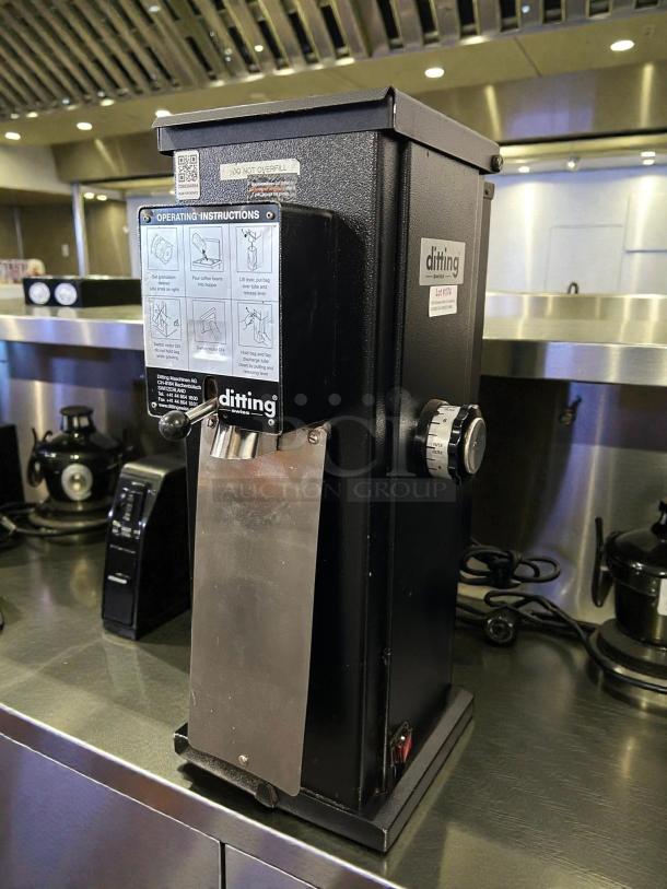 Ditting KR1403 commercial coffee grinder in excellent condition. Features include operational instructions label, sturdy design.