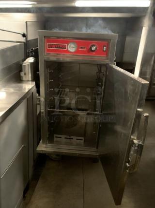 WITCO electric food warmer with open door, showing racks inside. Red control panel with dials; 120V. Premium condition.