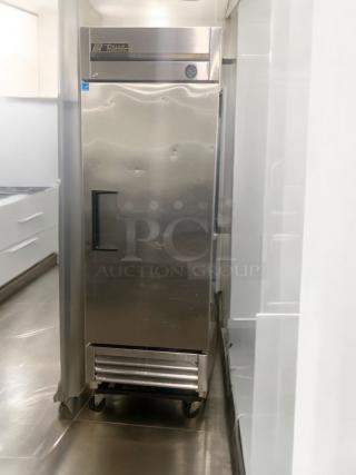 TRUE commercial single door upright freezer, superior condition, 115V, fully tested, stainless steel, wheeled base.